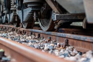 A train carriage with rocks on the side.