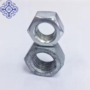 A close up of a couple of White Zinc 8.8 DIN934 Hex Nuts and flat washers.
